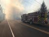 Smoke from a fire at Joint Base McGuire-Dix-Lakehurst creates a haze as a Medford fire truck responds. 